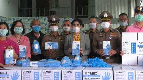 A raid on a warehouse used by Paddy the Room Trading Company in Bangkok, Thailand in December 2020. Deputy secretary-general of the Thai FDA Supattra Boonserm and members of the Royal Thai Police seized counterfeit nitrile gloves. The Thai FDA says SkyMed, the brand whose logo is on the boxes of gloves, is &quot;for sure fake.&quot;