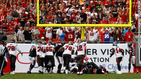 Brady celebrates after the Buccaneers scored a touchdown against the Chicago Bears.