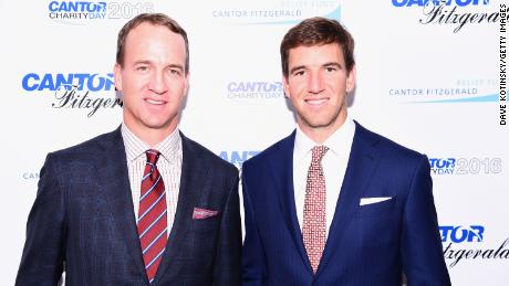 Peyton and Eli Manning attend the Annual Charity Day on September 12, 2016 in New York City. 