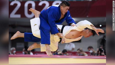 Japan&#39;s Hisayoshi Harasawa and South Korea&#39;s Kim Minjong compete in the judo men&#39;s +100kg elimination round during the Tokyo 2020 Olympic Games.