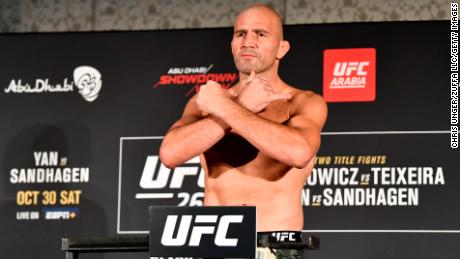 Teixeira poses on the scale during the UFC 267 weigh-in.