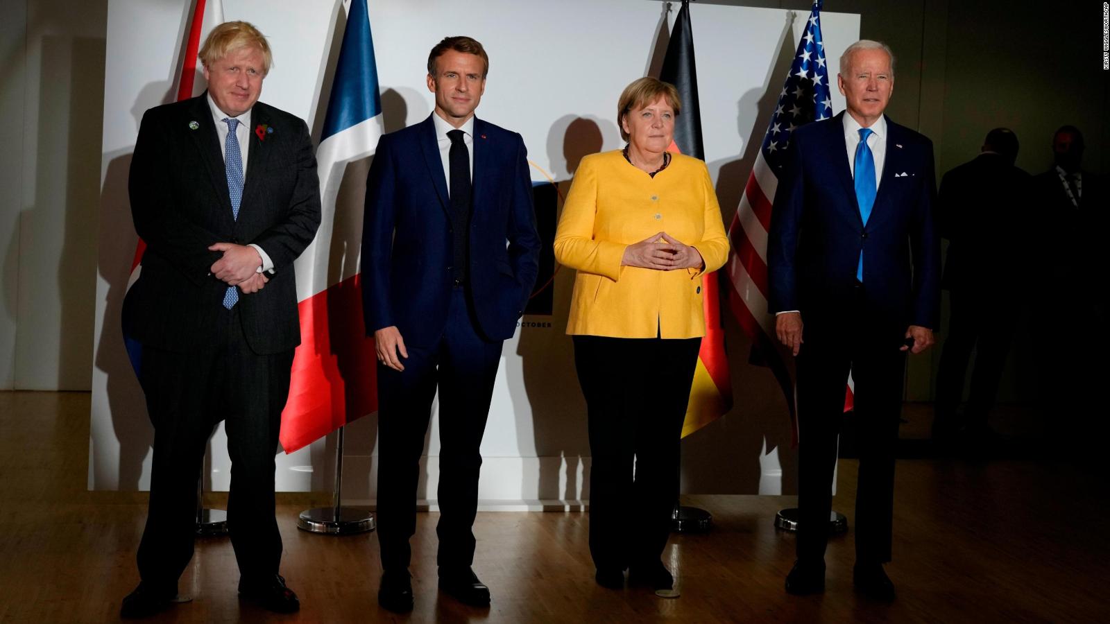 British Prime Minister Boris Johnson, French President Emmanuel Macron, German Chancellor Angela Merkel, and U.S. President Joe Biden, from left, pose for the media prior to a meeting at the La Nuvola conference center for the G20 summit in Rome, Saturday, Oct. 30.