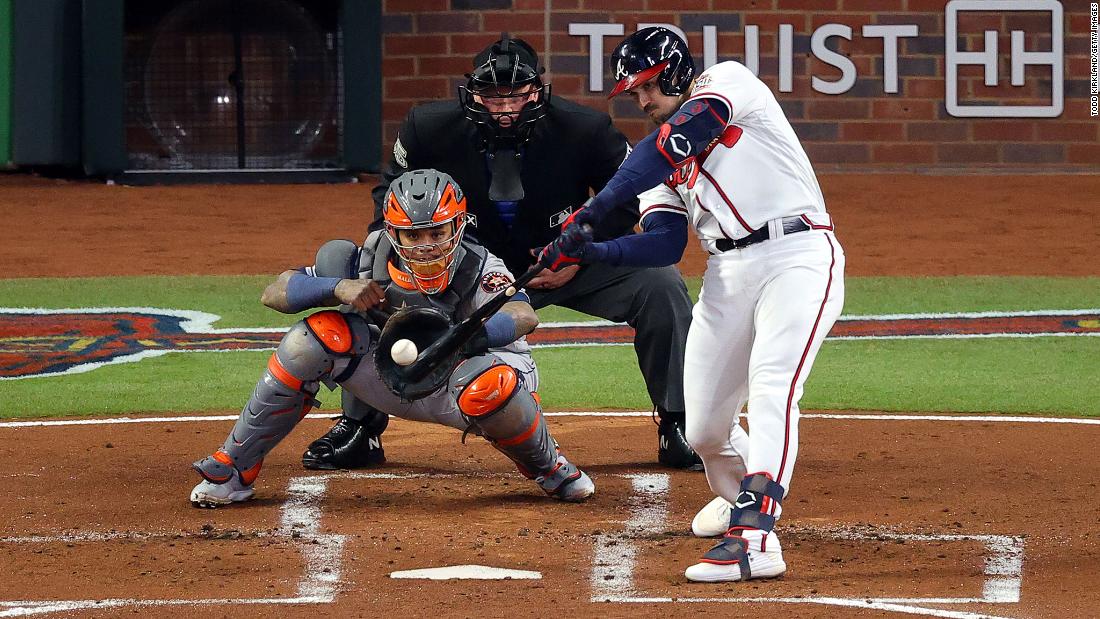 Adam Duvall of the Atlanta Braves hits a grand slam home run during the first inning of Game 5.