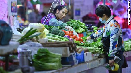 China is urging families to stock up on food as supply challenges multiply