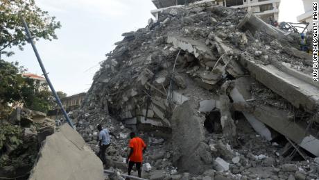 People buried under collapsed luxury high-rise in Nigeria call for help