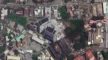 This satellite image provided by Maxar Technologies shows a collapsed building close to the center on Wednesday, November 3, 2021 in Lagos, Nigeria. 