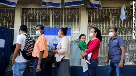 People wait in line to vote during Nicaragua&#39;s general election, at a polling station in Managua on November 7.
