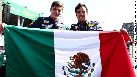 フェルスタッペン (左) and Perez celebrate finishing first and third in Mexico.