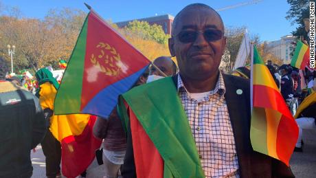 Berhanu Tadesse Taye, standing with protesters outside the White House, says he and many others support Ethiopian Prime Minister Adiy Ahmed.