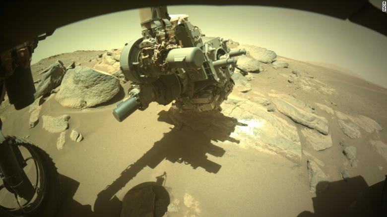 Mars rover scrapes at rock to 'look at something no one's ever seen'