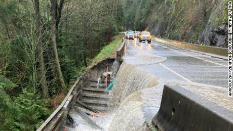 Relentless rain continued to batter Canada&#39;s Pacific coast on Monday, with water covering roads like the Malahat Highway on Vancouver Island.