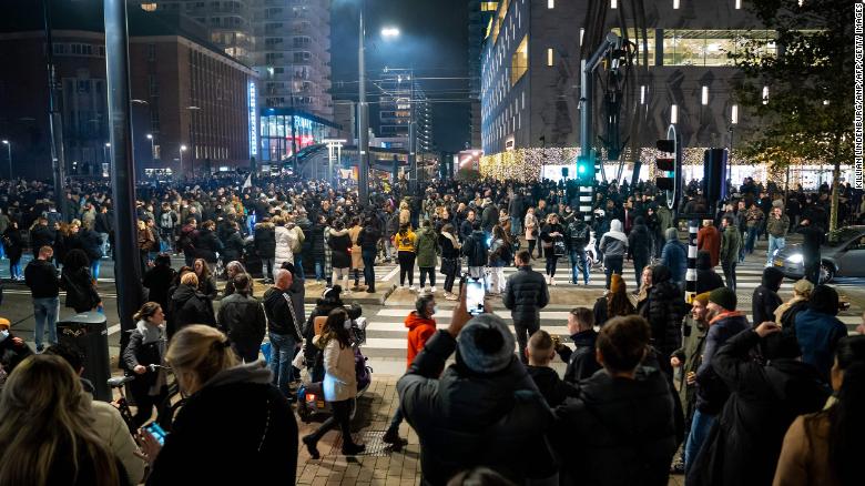 Injuries reported after Dutch police fire warning shots during Rotterdam protest over Covid-19 measures
