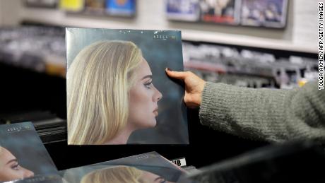 A member of staff sorts copies of Adele&#39;s new album &quot;30&quot; in Sister Ray record store in central London on November 19, 2021. 