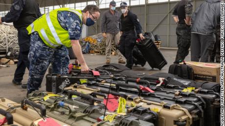 Australian Federal Police Special Operations officers prepare their equipment prior to departure from Canberra to the Solomon Islands capital of Honiara on November 25.