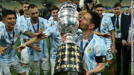 Messi kisses the trophy as he celebrates with teammates after winning the final of Copa America.