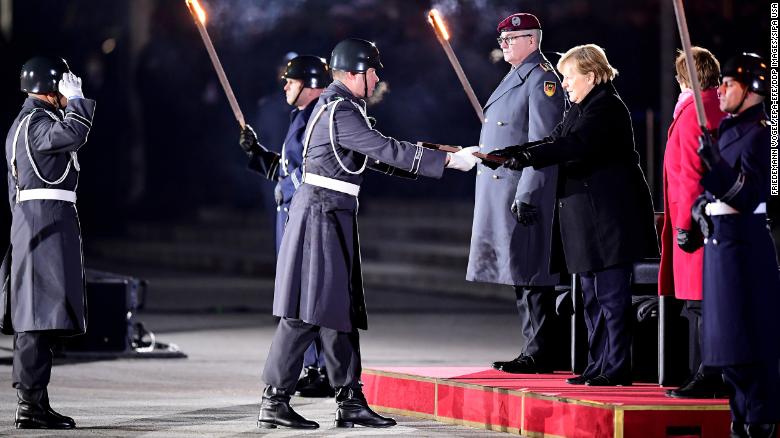 German military honors outgoing Chancellor Angela Merkel with punk rock sendoff