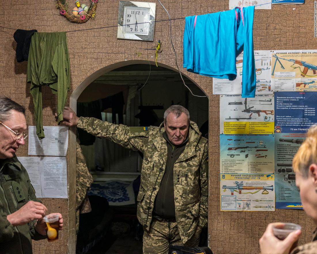 Ukrainian soldiers talk and drink tea in in Marinka on December 8.
