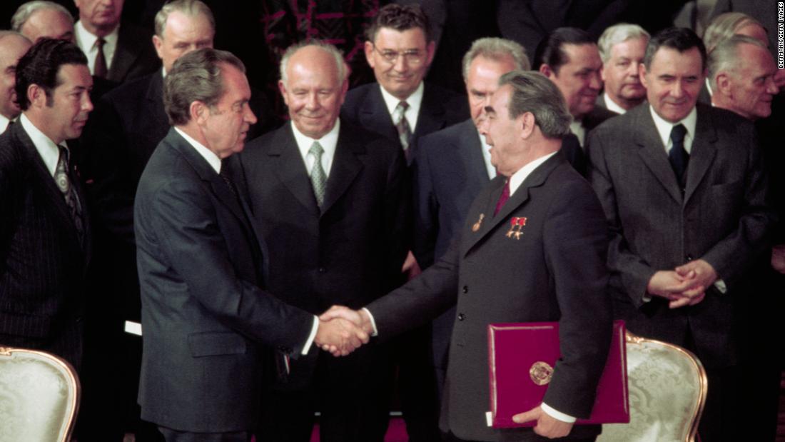 With Kremlin leaders and Presidential aides looking on, US President Richard Nixon shakes hands with Communist Party Chairman Leonid Brezhnev after signing one of several agreements made during their seven-day summit in 1974.