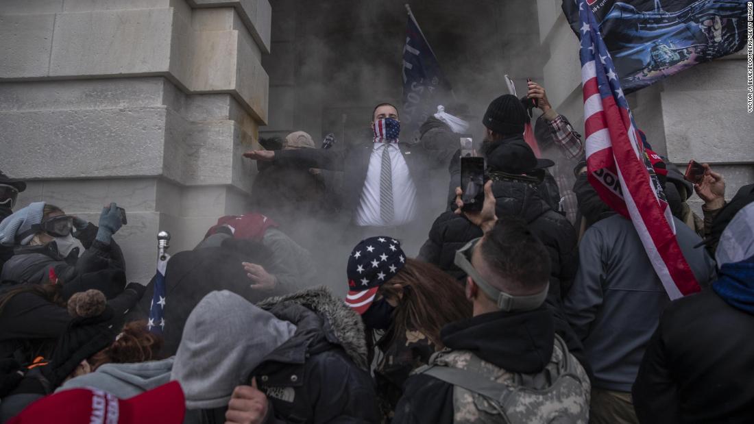 People try to breach the US Capitol on January 6, 2021. Hundreds of Donald Trump supporters swarmed past barricades surrounding the building.