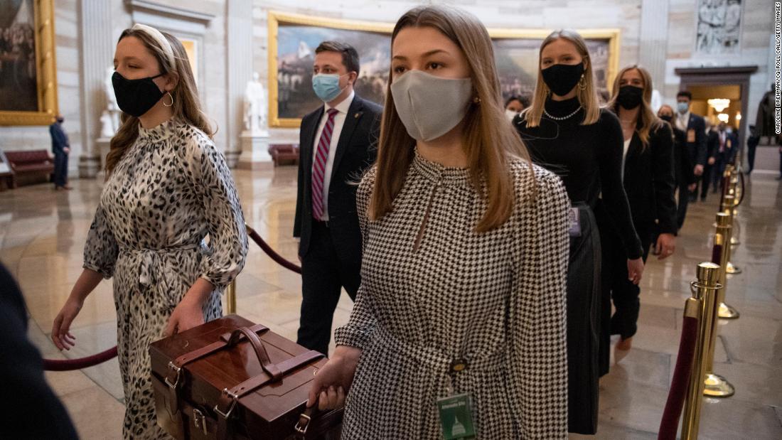 Chamber assistants carry Electoral College ballot boxes at the Capitol. 会議&#39; counting of electoral votes is typically little more than an afterthought. But this joint session was expected to be a contentious affair with some Republicans objecting to the count.