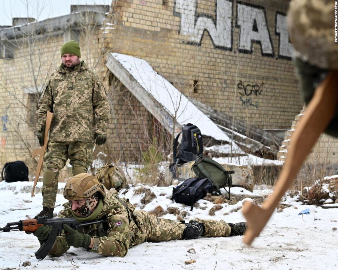 Ukrainian Territorial Defense Forces, the military reserve of the Ukrainian Armed Forces, holding wooden replicas of Kalashnikov rifles, take part in a military exercise near Kiev on December 25.