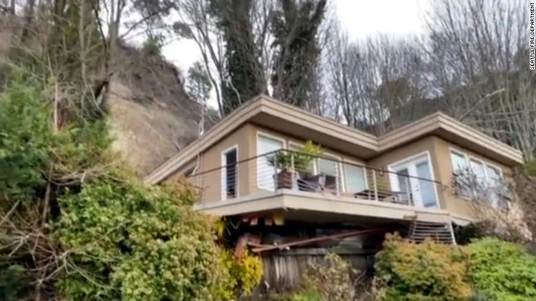 Man rescued after house slides off its foundation in Seattle following heavy rain