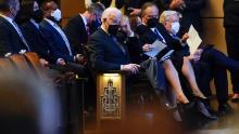 President Joe Biden wipes his eye as he attends a memorial service for former Senate Majority Leader Harry Reid with first lady Jill Biden, Vice President Kamala Harris and her husband Doug Emhoff at the Smith Center in Las Vegas, Saturday, Jan. 8, 2022.