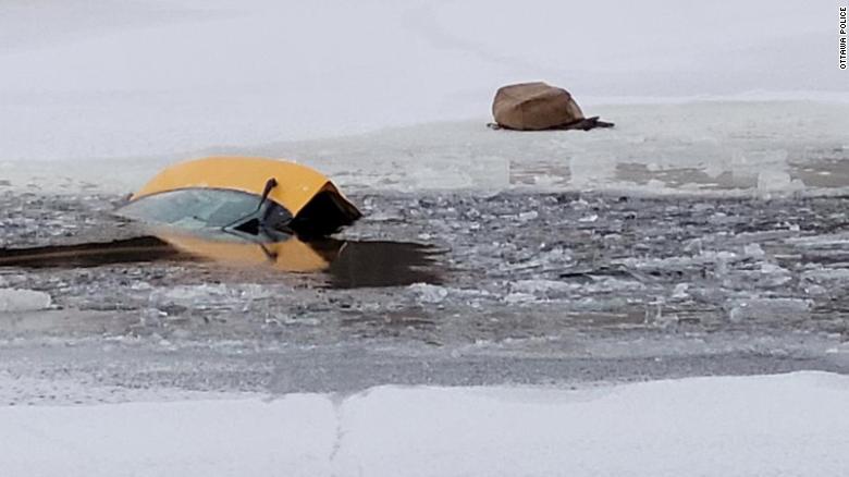 Residents save driver after car sinks in frozen river