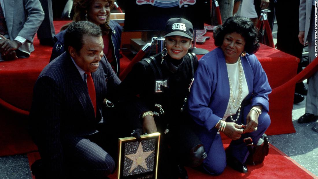 Janet Jackson, center, receives a star on the Hollywood Walk of Fame with her parents, Joe and Katherine Jackson, in 1990.