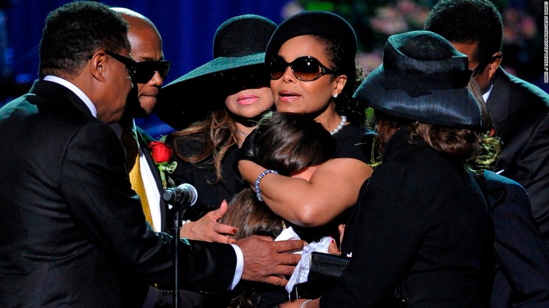 Janet Jackson comforts her niece, Paris Jackson, during the memorial service for Michael Jackson at the Staples Center in Los Angeles on July 7, 2009.