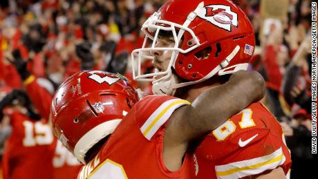 Kelce celebrates with Hill after catching the game-winning touchdown in overtime.