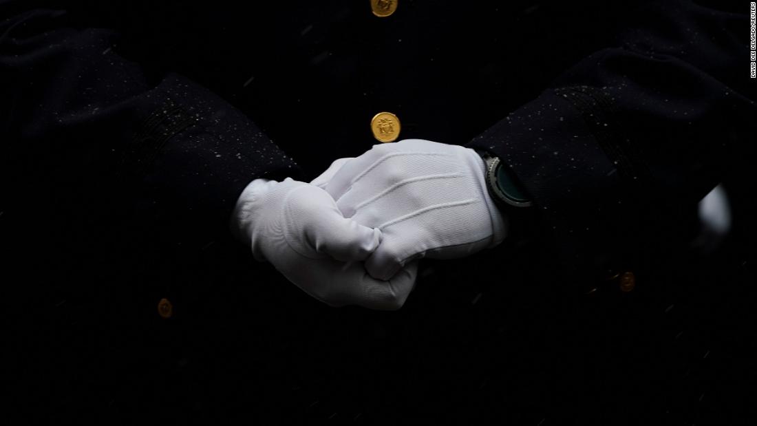 A member of the NYPD attends Rivera&#39;s funeral.