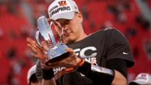 Burrow holds the Lamar Hunt trophy after beating the Chiefs.