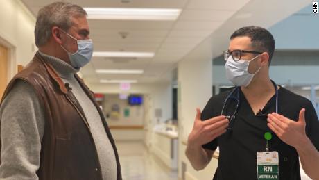 Mark Schimmelpfennig (left), seen here with nurse David Bracho, is using techniques from the military to help nurses deal with PTSD, grief and trauma.
