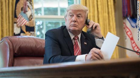 US President Donald Trump waits to speak on the phone with Irish Prime Minister Leo Varadkar to congratulate him on his recent election victory in the Oval Office at the White House in Washington, DC, on June 27, 2017. (Photo by NICHOLAS KAMM / AFP)        (Photo credit should read NICHOLAS KAMM/AFP via Getty Images)