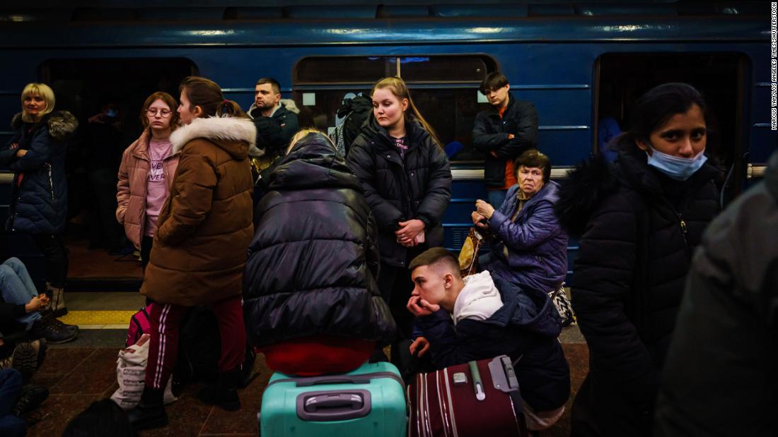 People seek shelter inside a subway station in Kharkiv on February 24.