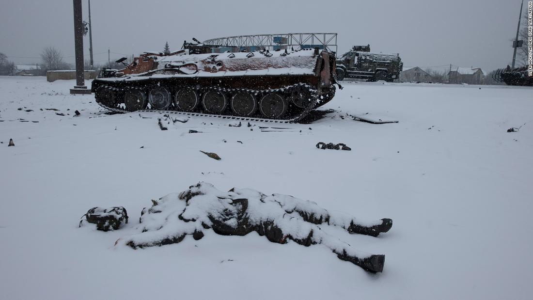 The body of a Russian soldier lies next to a Russian vehicle outside Kharkiv on February 25.