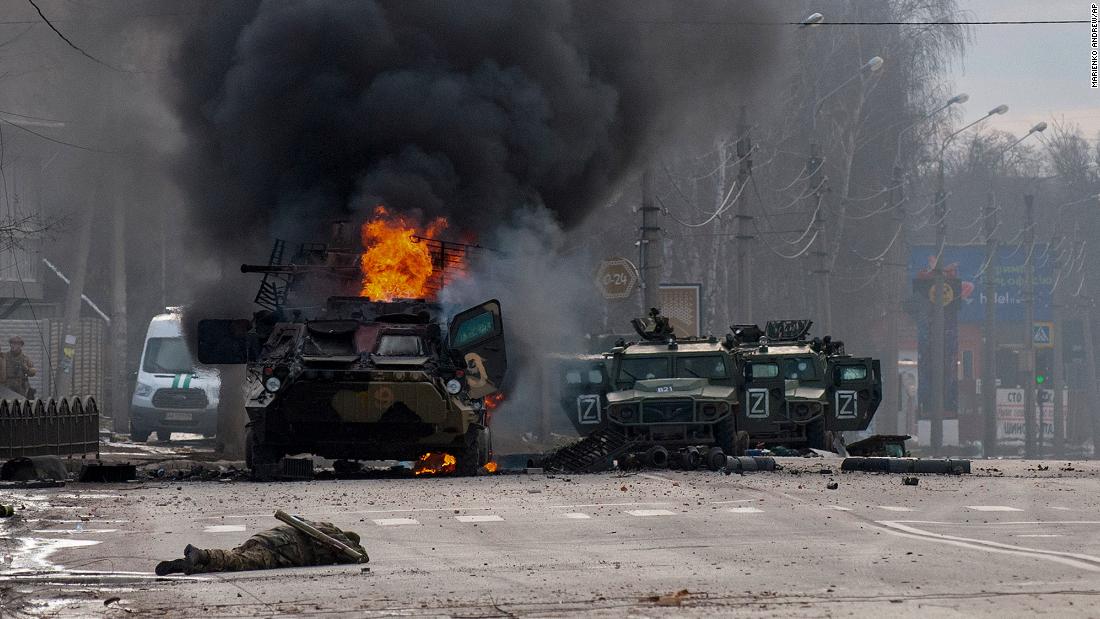 A Russian armored vehicle burns after fighting in Kharkiv on February 27. Street fighting broke out as Russian troops entered Ukraine&#39;s second-largest city, and residents were urged to stay in shelters and not travel.