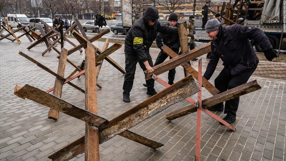 Militia members set up anti-tank barricades in Kyiv on March 2.