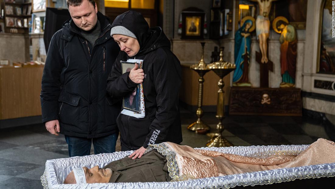 Oksana and her son Dmytro stand over the open casket of her husband, Volodymyr Nezhenets, during his funeral in Kyiv on March 4. &lt;a href=&quot;https://www.washingtonpost.com/world/2022/03/04/ukraine-russia-casualties-kyiv/&quot; target=&quot;_blank&quot;&gt;According to the Washington Post,&lt;/a&gt; he was a member of Ukraine&#39;s Territorial Defense Forces, which is comprised mostly of volunteers.