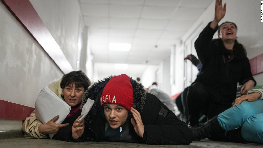 People take shelter on the floor of a hospital during shelling in Mariupol on March 4.