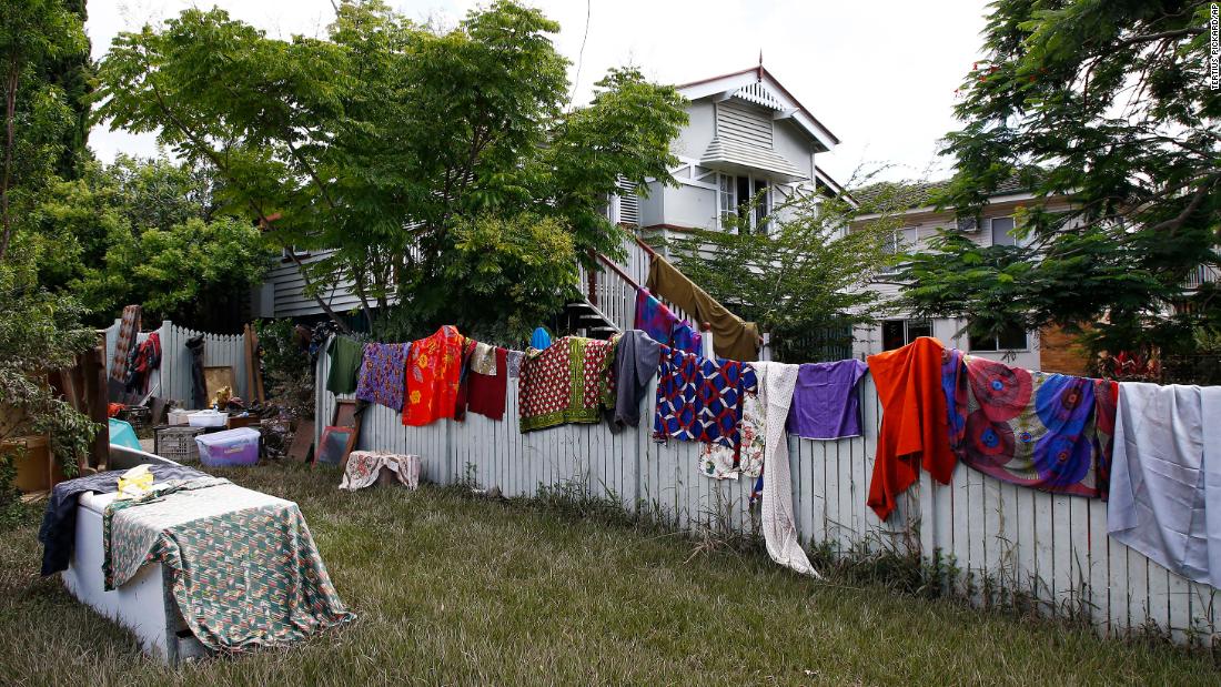 Blankets and sheets dry outside a flooded home in Brisbane on March 2.