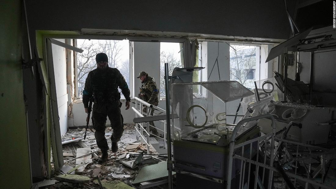Ukrainian servicemen work inside the damaged maternity hospital in Mariupol on March 9. &quot;The destruction is enormous,&quot; the city council said. &quot;The building of the medical facility where the children were treated recently is completely destroyed.&kwotasie;