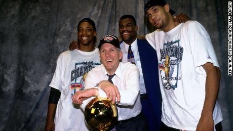 (L-R) Sean Elliot, head coach Popovich, David Robinson, and Tim Duncan of the San Antonio Spurs pose after winning the 1999 NBA Championship.