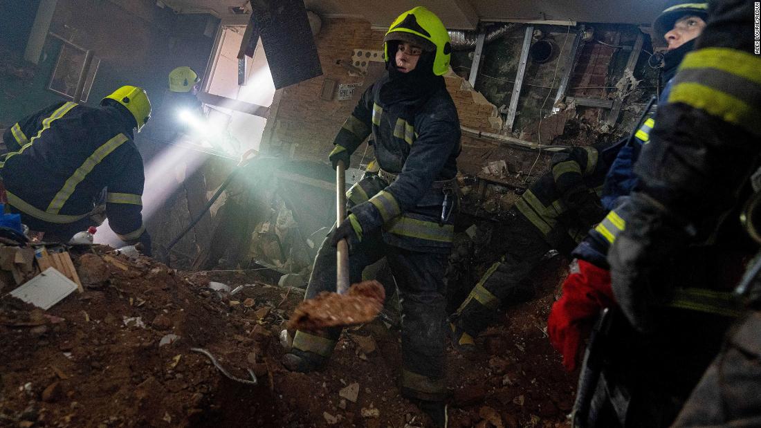 Firefighters search a building for survivors after an attack in Kharkiv on March 14. At least one dead body was pulled from the rubble after hours of digging.