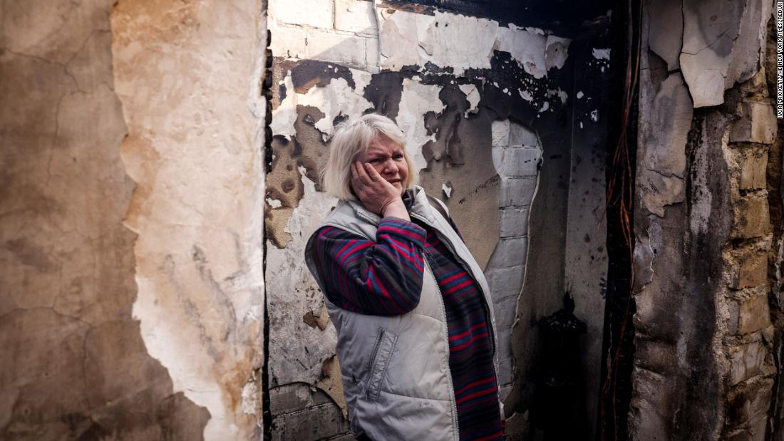 Svetlana Ilyuhina looks at the wreckage of her home in Kyiv following a Russian rocket attack on March 23. &quot;First there was smoke, and then everything went black,&quot; she said.
