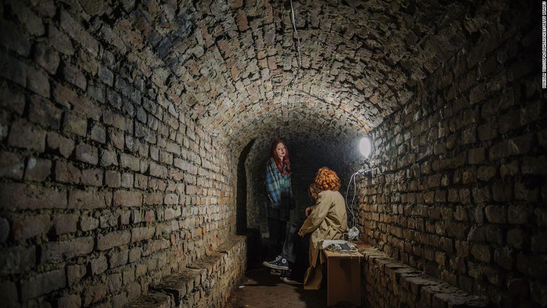 People hide in an underground shelter in Lviv on Tuesday, marzo 22.