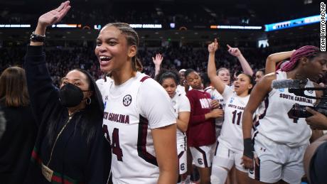 South Carolina guard LeLe Grissett (24) and head coach Dawn Staley celebrate after a second-round game against Miami in the NCAA college basketball tournament on March 20, 2022.