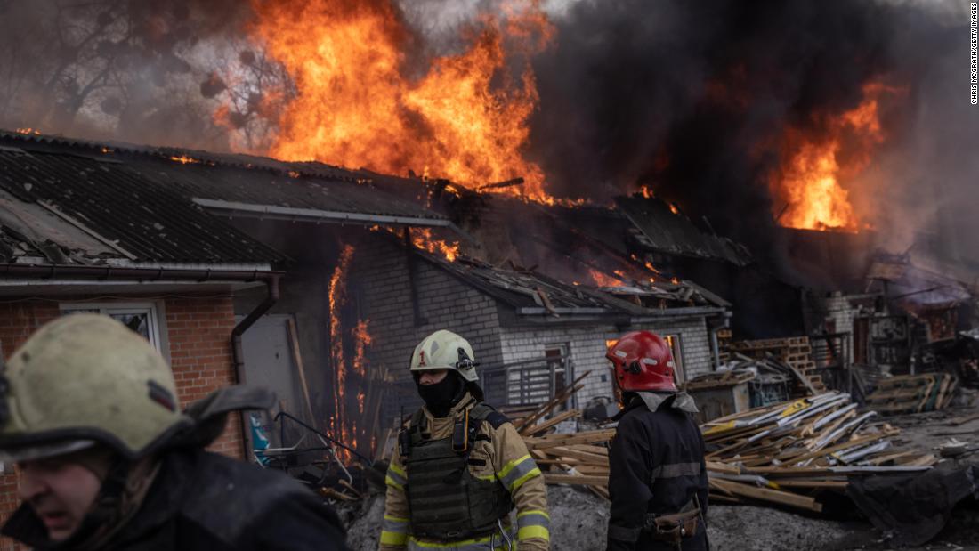 Firefighters work to extinguish a fire at a warehouse after it was hit by Russian shelling on March 28 in Kharkiv, Ucraina.
