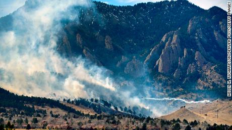 BOULDER, CO - MARCH 26: A single engine air tanker drops water on the NCAR fire as it burns in the foothills south of the National Center for Atmospheric Research on March 26, 2022 in Boulder, Colorado. The NCAR fire prompted evacuations in south Boulder and  pre-evacuation warning for Eldorado Springs.The wildfire broke out near the National Center for Atmospheric Research in southwestern Boulder on Saturday afternoon, prompting evacuation orders for parts of the city and pre-evacuation notices for Eldorado Springs, according to authorities. Boulder police initially said about 1,200 residences had been ordered to evacuate due to what has been named the NCAR fire. But a short time later, police tweeted a map that showed nearly all of south Boulder under evacuation. The Boulder Office of Emergency Management now says that map was wider than required, and that the actual evacuation area is &quot;u201cfrom NCAR to Baseline Road, east to U.S. 36, back down to Broadway, and straight west to NCAR again.&quot;u201d&quot;nThe town of Superior posted a notice saying its staff had been in contact with a Boulder County sheriff&quot;u2019s sergeant who said the fire is about 20 acres in size and moving south/southeast toward Eldorado Springs in southwestern Boulder County. (Photo by Helen H. Richardson/MediaNews Group/The Denver Post via Getty Images)